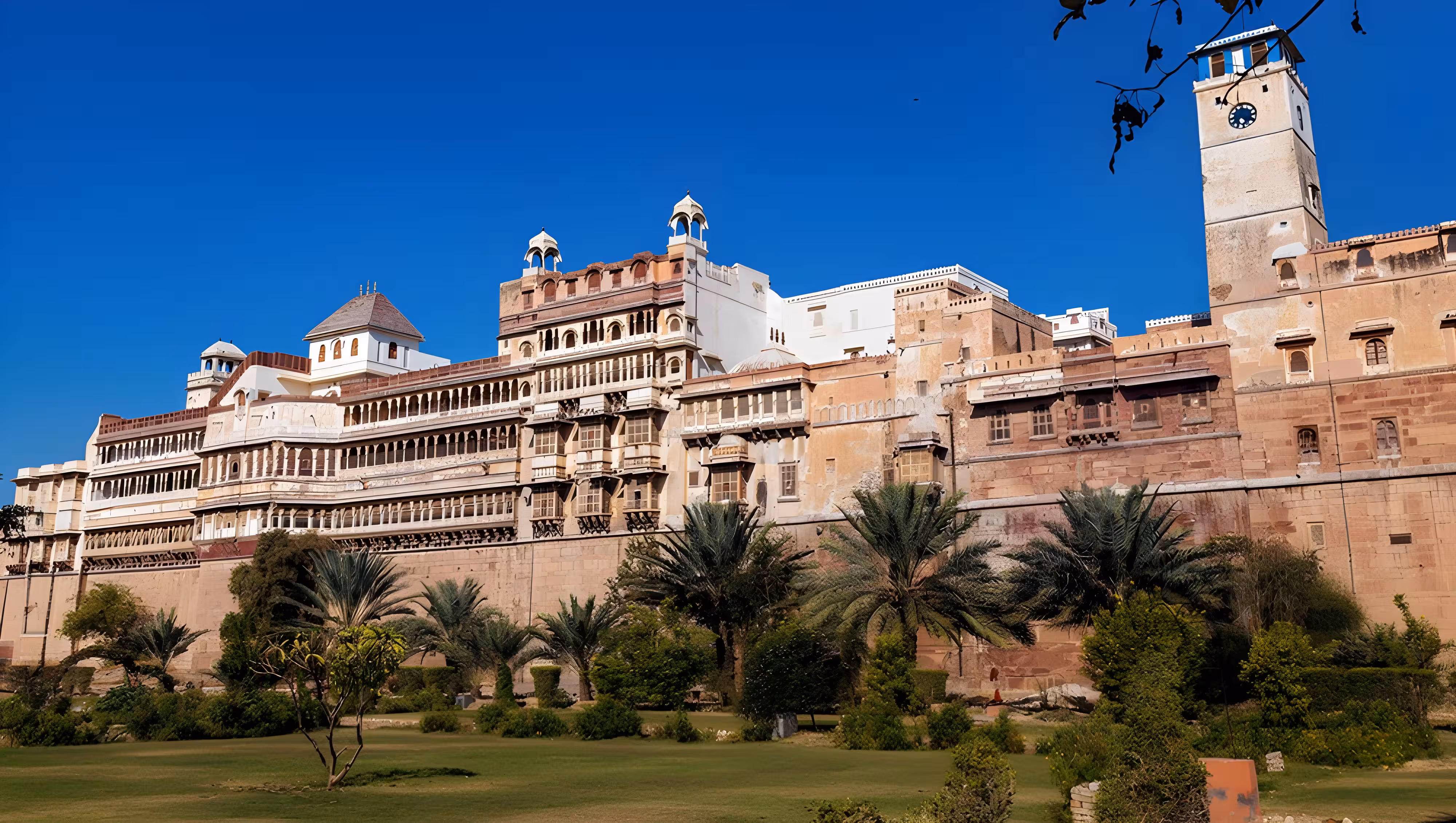 Junagarh Fort in Bikaner, Rajasthan, a historic 16th-century fortress featuring red sandstone architecture, ornate palaces, courtyards, and intricate carvings under a clear sky.