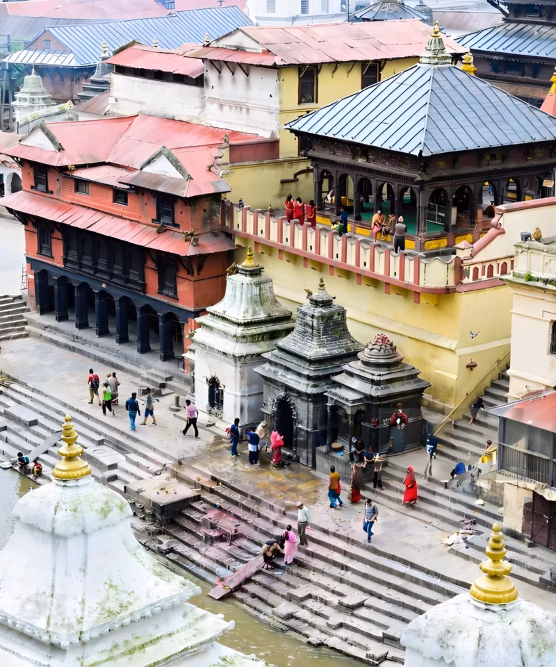 Busy street scene in Kathmandu with local shops, people, and daily life